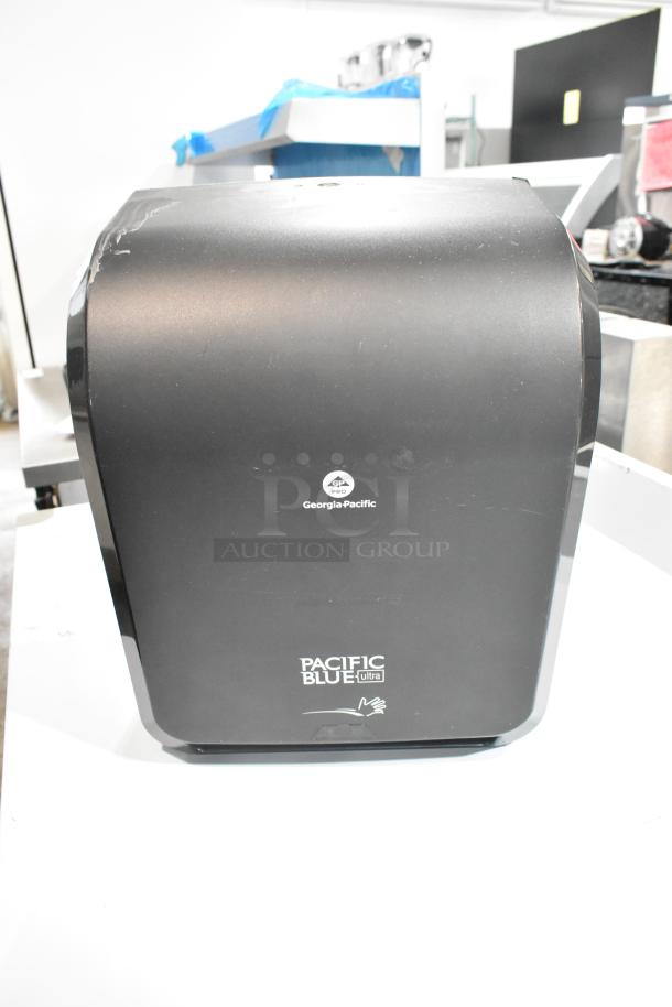 Georgia Pacific black poly wall mount paper towel dispenser, model Pacific Blue Ultra, minor wear, logo visible.