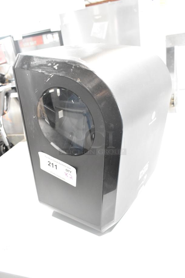 Georgia Pacific black poly wall mount paper towel dispenser, slightly worn, with auction tag indicating quantity two.