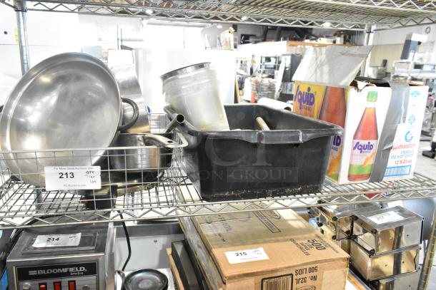Auction lot featuring a sauce pan, poly bus bin, assorted dishes, and Squid Brand boxes, all on a metal shelf.