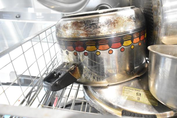 Vintage sauce pan with decorative pattern, worn exterior; included in tier lot with various kitchen items.
