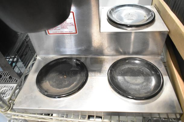 Bloomfield 8571 stainless steel 3-burner coffee machine, visible wear, includes poly brew basket, 120V, 1 phase.
