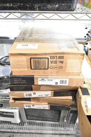 Boxes of 32JL lids and 5 Church 255 000 toilet seats. Labels show item details; bulk auction lot, good condition.
