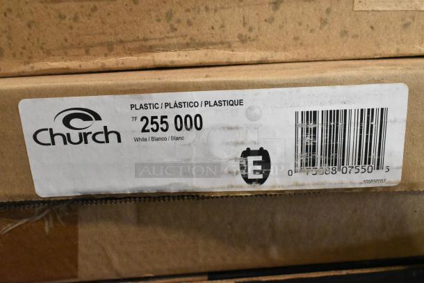 Box of Church 255 000 white plastic toilet seats with visible labels indicating model and material.