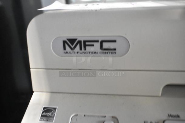 Brother MFC-7360N multi-function printer with scanner and copier, white, showing "MFC" branding on the control panel.