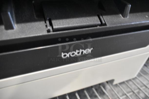 Brother MFC-7360N printer, scanner, and copier machine. Black and gray design with Brother logo visible in good condition.