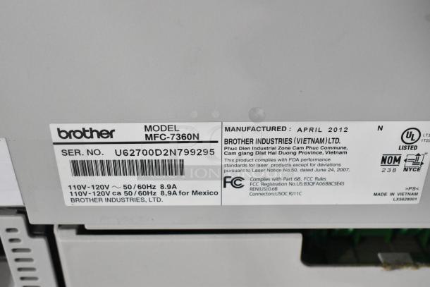 Brother MFC-7360N printer with label showing model and serial number. Manufactured April 2012 in Vietnam.