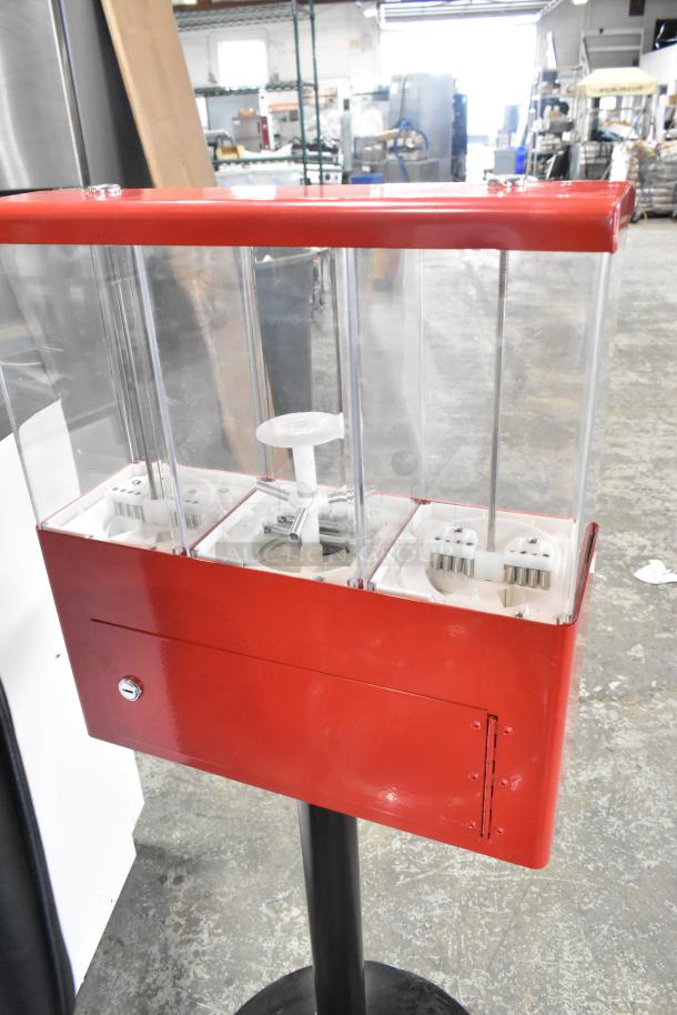 Red metal 3 compartment vending machine, clear display, good condition, lockable panel, suitable for snacks or capsules.