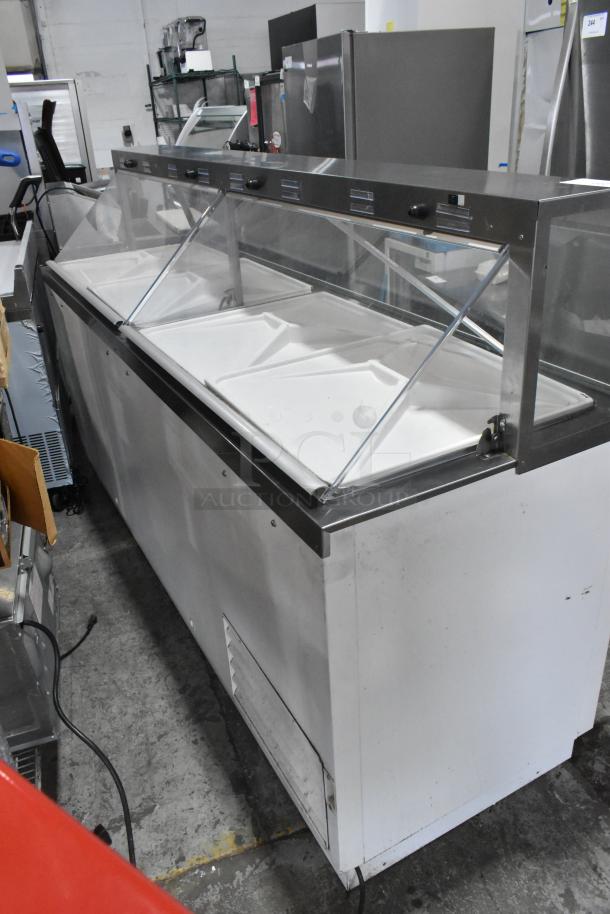 2016 True TDC-87 commercial ice cream dipping cabinet, metal, 115 volts, 1 phase, glass top, floor style, used condition.