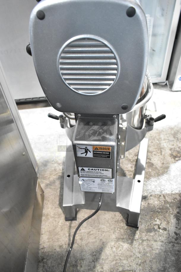 Avantco 177MX20H commercial 20-quart mixer with stainless bowl, bowl guard, whisk, paddle, dough hook, 120V. Caution labels visible.