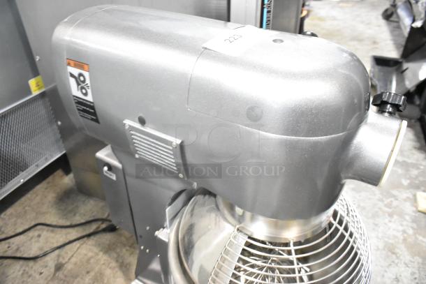 Avantco 177MX20H 20 qt metal commercial dough mixer with stainless steel bowl, bowl guard, whisk, paddle, and dough hook.