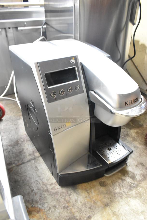 Keurig B3000SE single cup coffee machine, sleek design, 120 volts, 1 phase, clear digital display, slightly used condition.