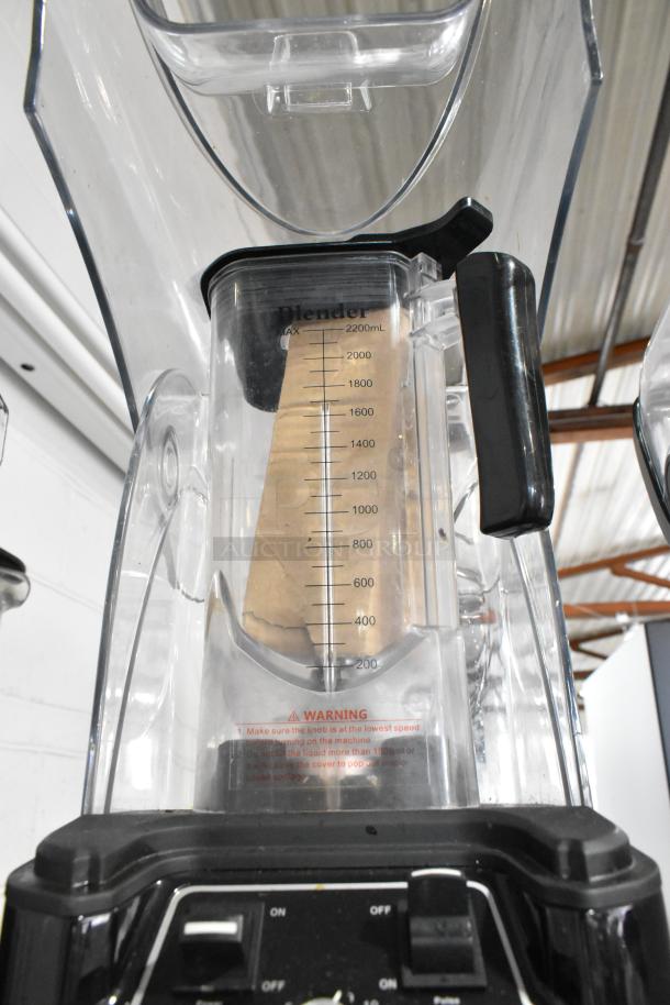 Cranddi K90 Blender Base with Pitcher and Enclosure Cover, 110 Volts. Visible measurements, warning label on pitcher.