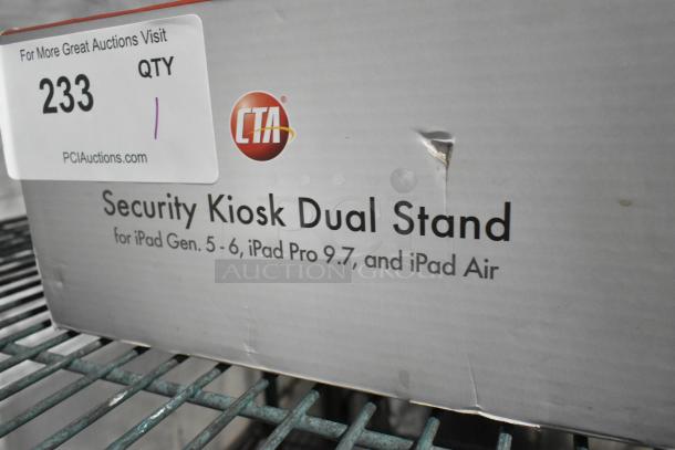 BRAND NEW CTA Security Kiosk Dual Stand box with visible scratch, designed for iPad Gen. 5-6, iPad Pro 9.7, and iPad Air.