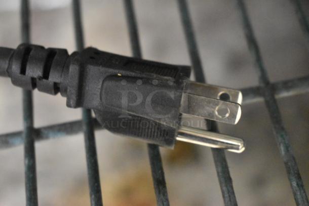 Close-up of a power plug for the 2024 Estella 348WCMX1A Stainless Steel Commercial Countertop Cone Rotating Waffle Maker.