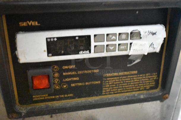 Sevel metal gelato case control panel with brand logo, manual defrost, lighting options, and labeled buttons.