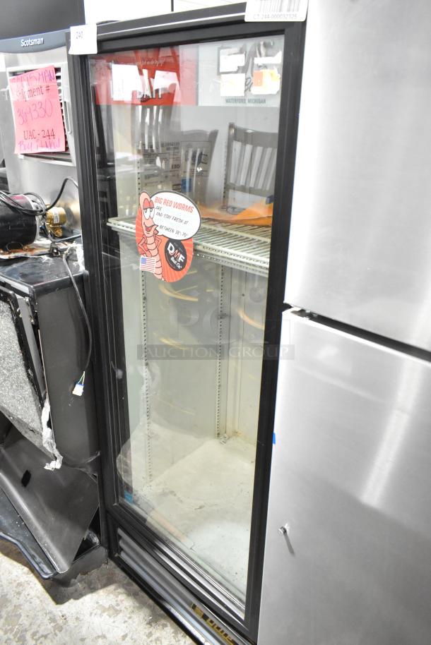 True GDM-12-LD metal single door cooler merchandiser with poly coated racks, visible sticker, used condition.