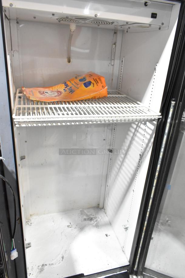 True GDM-12-LD commercial single door reach-in cooler, white interior, poly-coated rack, 115 volts, used condition.
