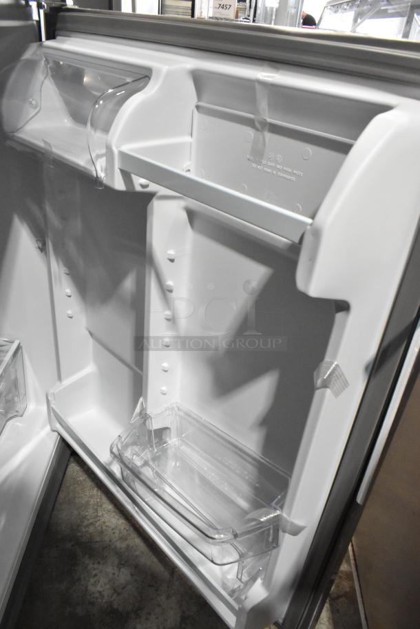 Brand new Whirlpool 21MSTFATR6 stainless steel cooler with freezer, 115 volts, 1 phase, interior view.