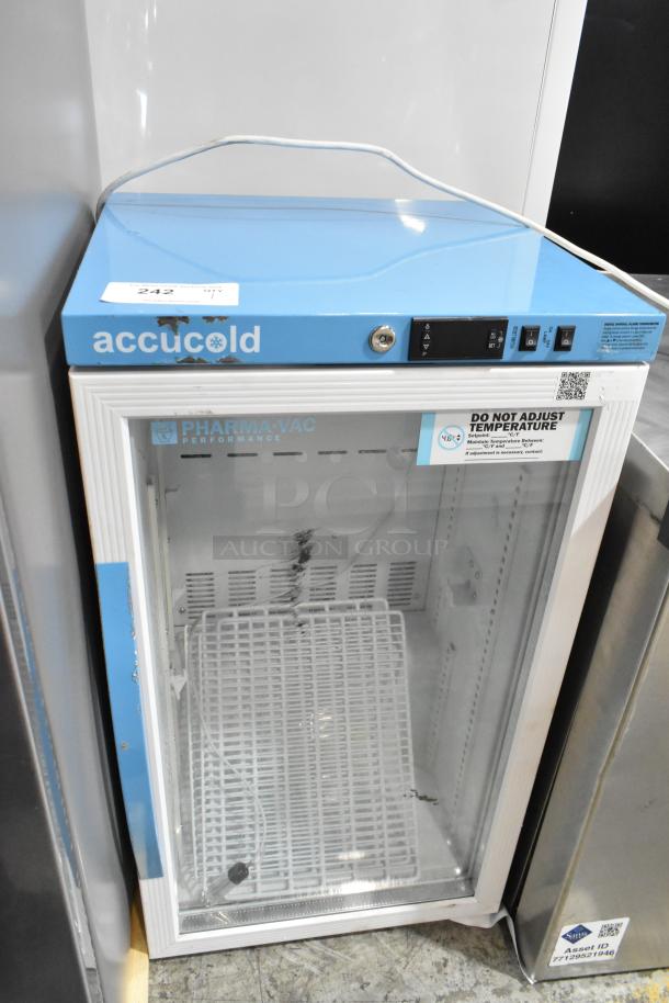 Accucold ARG3PV metal mini cooler merchandiser, blue top, glass door, 115 volts, 1 phase, with visible usage wear.