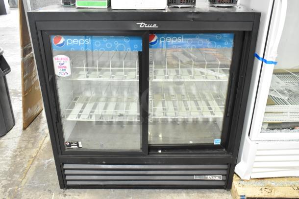 2021 True GDM-41SL-48-HC-LD commercial cooler, 2 doors, metal, poly coated racks, 115 volts, excellent condition.