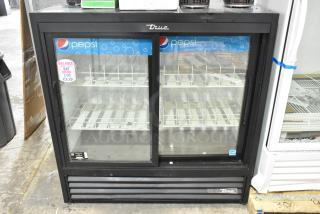 2021 True GDM-41SL-48-HC-LD commercial cooler, 2 doors, metal, poly coated racks, 115 volts, excellent condition.