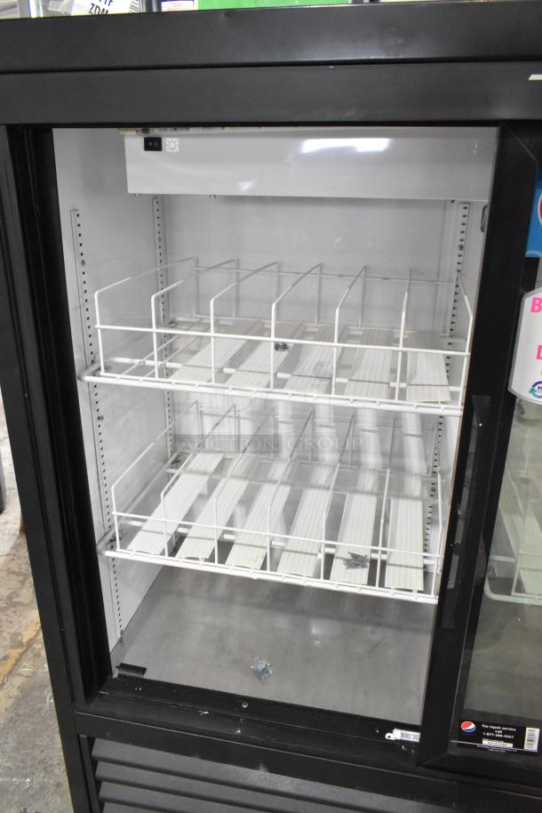 2021 True GDM-41SL-48-HC-LD commercial cooler, 2-door, poly-coated racks, metal frame, 115 volts, 1 phase, excellent condition.