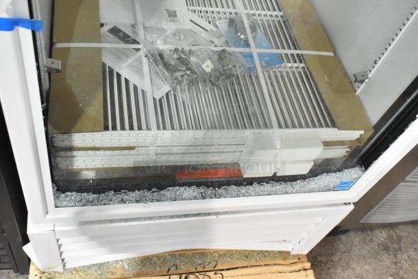 Brand new True TSCI-600R-G-PH single door reach-in cooler merchandiser, poly-coated racks, glass damaged, 115V, 1 phase.