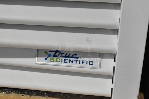 Brand new True TSCI-600R-G-PH cooler label, showcasing "True Scientific" branding, metal finish, with minor scratches.