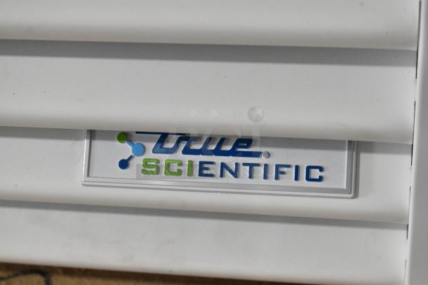 True TSCI-600R-G-PH cooler, brand new, single door, poly-coated racks, 115 volts, 1 phase, "True Scientific" label visible.