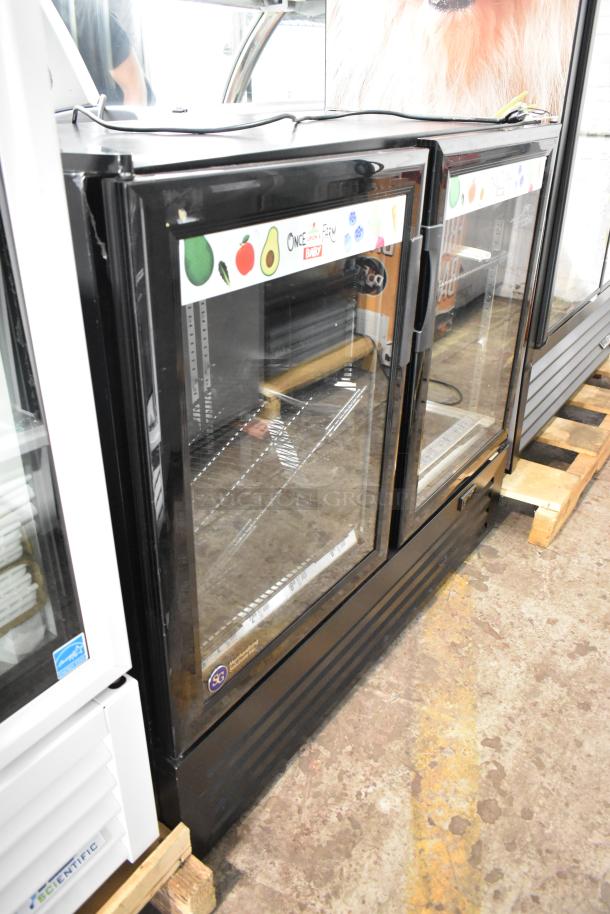 SG DD-12 metal commercial 2-door reach-in cooler merchandiser with poly-coated racks. 115 volts, 1 phase. Visible branding.