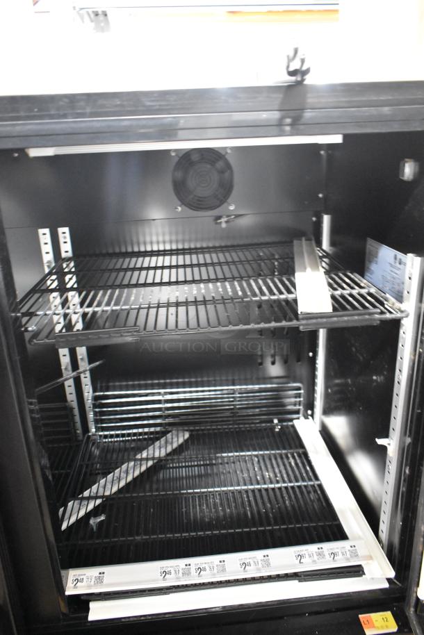 SG DD-12 metal commercial 2-door reach-in cooler with poly coated racks, 115 volts, 1 phase, clean interior, visible fan.