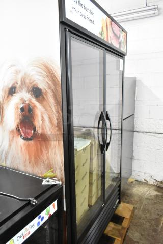 True TVM-48SL-HC 2 Door Reach-In Cooler Merchandiser. Metal frame, 115 Volts, excellent condition, storefront ready.