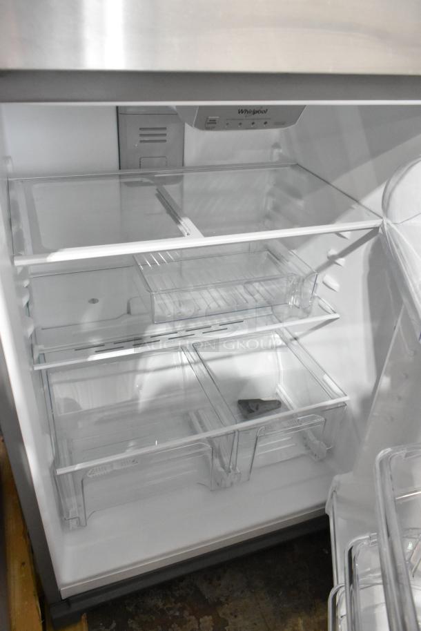 Brand new Whirlpool WRT311FZDM05 stainless steel cooler with freezer, interior view. 115 volts, 1 phase, visible Whirlpool logo.