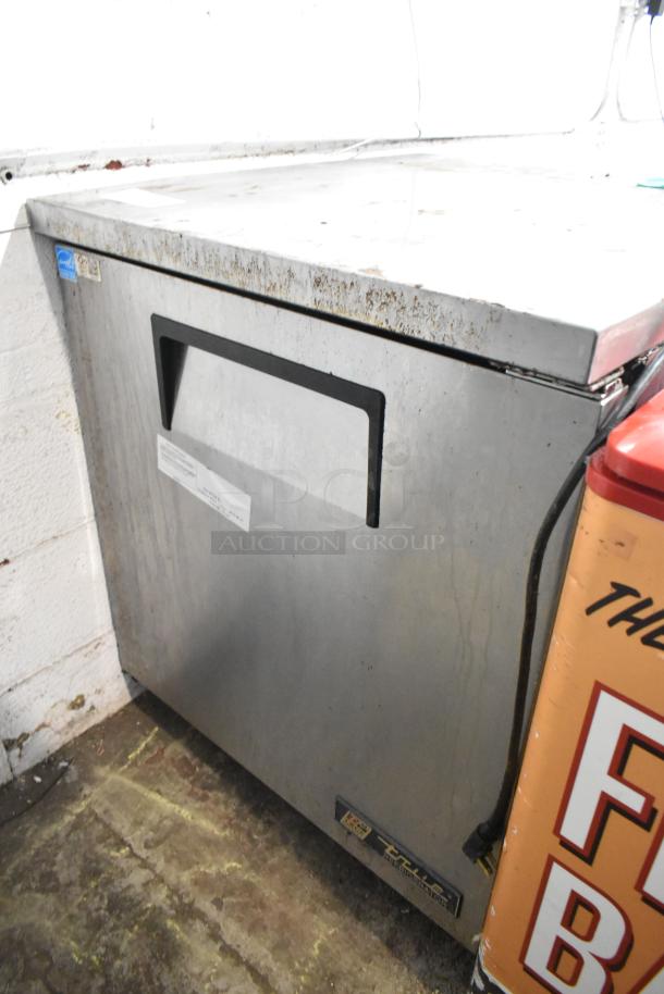 True TUC-27 stainless steel undercounter cooler, single door, commercial casters, 115V, 1 Phase, visible wear.