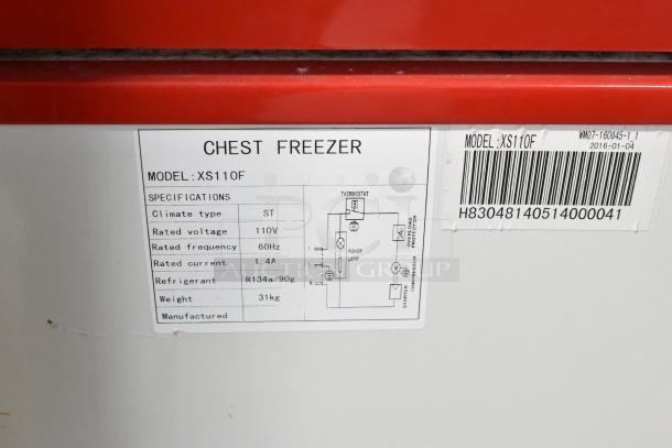 Alt Text: XS110F Metal Chest Freezer Merchandiser label with specs; climate type ST, 110V, 60Hz, 1.4A, R134a refrigerant.