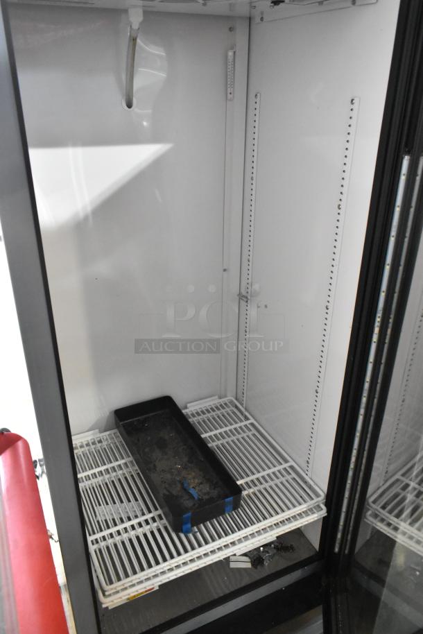 2021 True GDM-12-HC commercial cooler with single glass door, poly-coated racks, 115V, slight interior wear visible.
