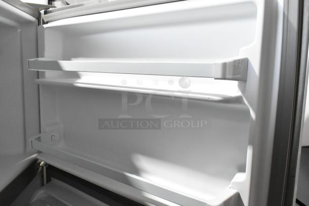Brand new 2025 Whirlpool WRT311FZDM05 stainless steel cooler with freezer interior. Scratch and dent model.