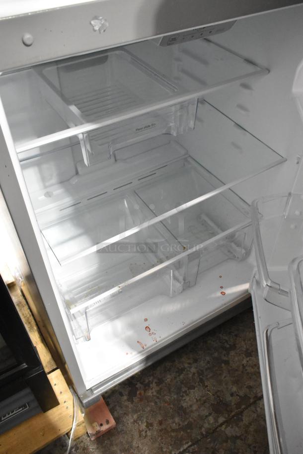Brand new Whirlpool WRT311FZDM05 stainless steel cooler with freezer, 115V, 1 Phase. Interior with shelves, scratch and dent condition.
