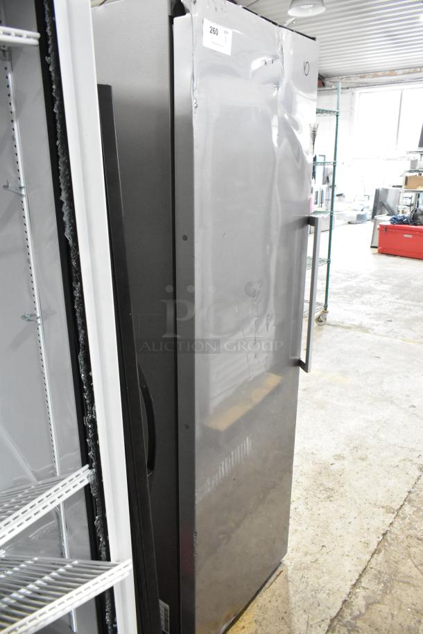 Samsung RZ11M7074SA stainless steel single door reach-in freezer. Features 115 volts, 1 phase power. Visible dent on door.