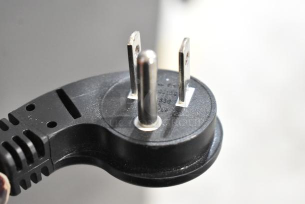 Close-up of a three-prong black power plug for a Samsung RZ11M7074SA stainless steel freezer, 115 volts, 1 phase.