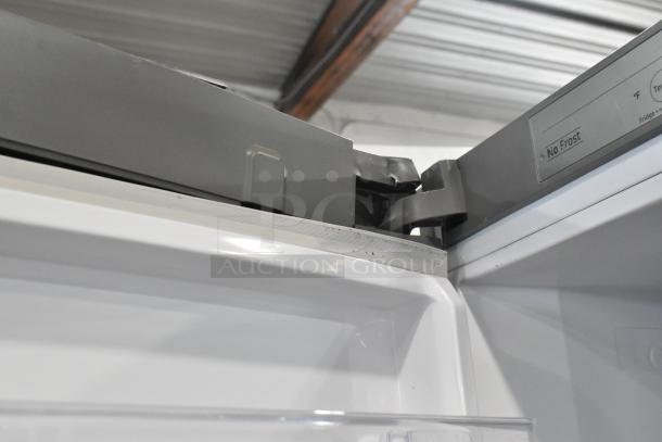 Samsung RZ11M7074SA stainless steel freezer, single door, reach-in. No Frost technology. 115V, 1 phase. Top hinge detail.