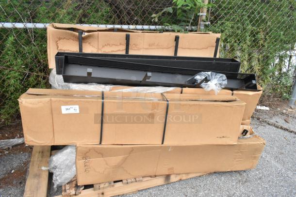 11 new scratch and dent items, including condiment rack model 6001021419100U0015, boxed and on wooden pallet.