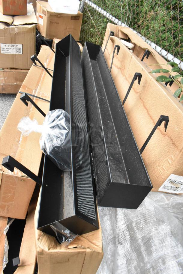 11 brand new scratch and dent condiment racks, model 6001021419100U0015, stacked on boxes; includes mounting hardware in bags.
