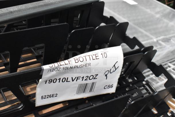 Black 19010LVF12OZ 10 Lane Universal Pusher Glide Bottle Organizer with label. New condition, for 12 oz. and 16 oz. bottles/cans.
