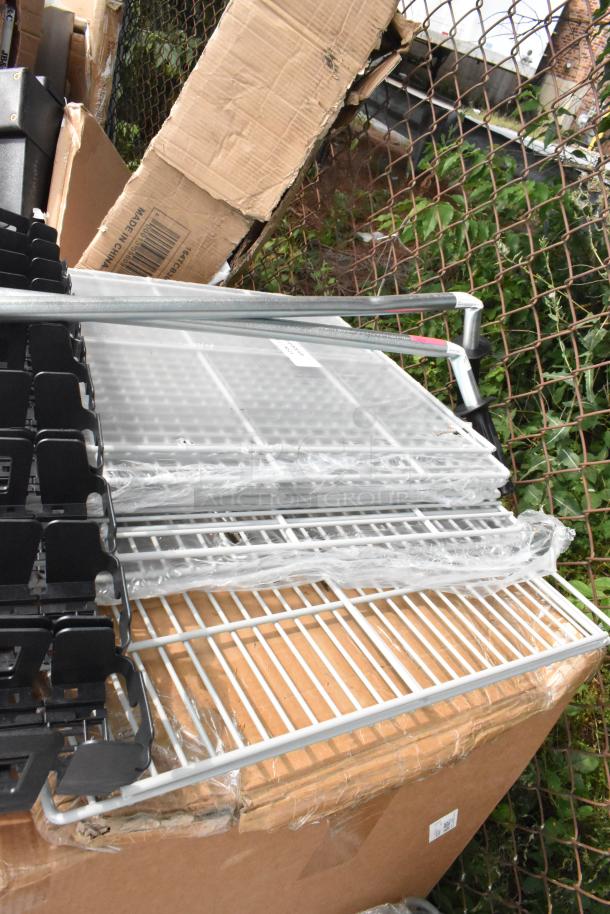 Brand new Steelton 18" x 36" ice bin and 19010LVF12OZ pusher glide organizer, packaged in boxes with protective wrap.