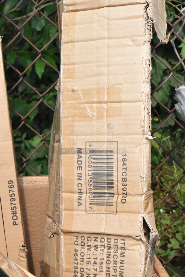 Damaged cardboard box labeled "164TCB3072D," indicating item as a dining table base, made in China. Box shows shipping wear.