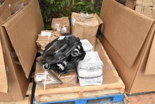 Assorted new items and packaging, including Visions 10" plates, table base, trash dolly, vacuum bags, Henny Penny basket kit.