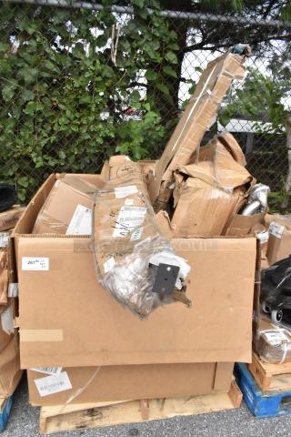 Cardboard boxes of 10 new scratch and dent items; includes metal table base and Regency wire shelf. Marked labels visible.