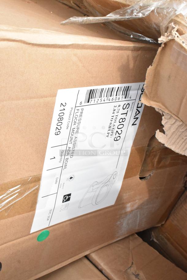 Cardboard box labeled "Sloan ST8029" containing pressure-assisted floor mount ADA bowls, new condition, ready for auction.