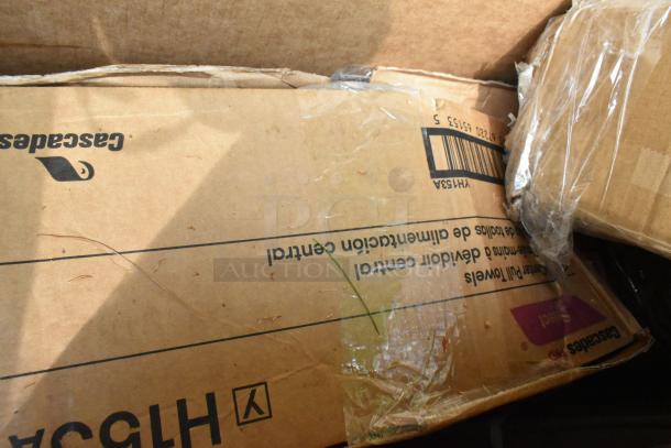 Damaged box with visible Cascades brand marking, containing a new 164TCB3096D metal table base and 460EG2460 green wire shelf.